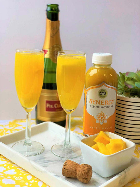 two glasses of mango mimosa cocktails